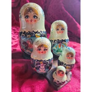 Set of Five Hand painted Matryoshka dolls, known as Russian nesting dolls.